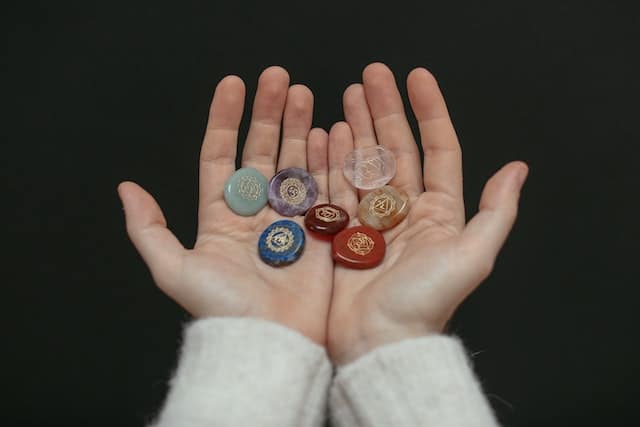 Chakra crystals in hands