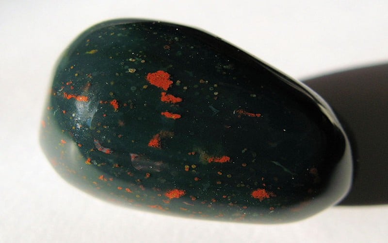 Discover the powerful properties of Bloodstone, also known as Heliotrope, a crystal known for its grounding, healing, and protective qualities.